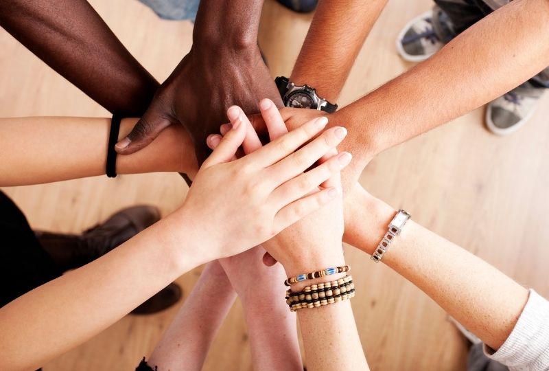 Hands on top of each other